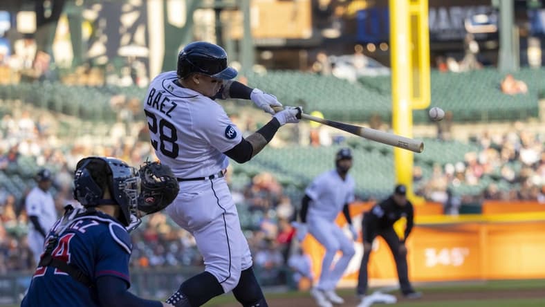 Oct 1, 2022; Detroit, Michigan, USA; Detroit Tigers shortstop Javier Baez (28) hits an RBI single in the first inning against the Minnesota Twins at Comerica Park. Mandatory Credit: David Reginek-USA TODAY Sports