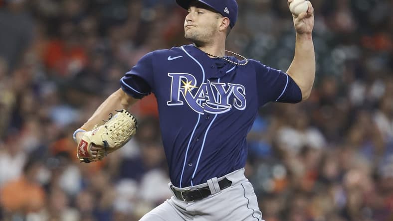 Oct 1, 2022; Houston, Texas, USA; Tampa Bay Rays starting pitcher Shane McClanahan (18) delivers a pitch during the first inning against the Houston Astros at Minute Maid Park. Mandatory Credit: Troy Taormina-USA TODAY Sports