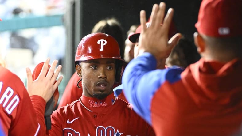 Oct 1, 2022; Washington, District of Columbia, US; Philadelphia Phillies second baseman Jean Segura (2) is congratulated by teammates after scoring a run during the second inning against the Washington Nationals at Nationals Park. Mandatory Credit: Brad Mills-USA TODAY Sports