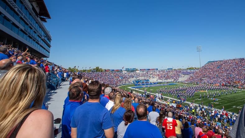 A formation of F-16 fighter jets fly over David Booth Kansas Memorial Stadium before the start of Saturday's game against Iowa State.