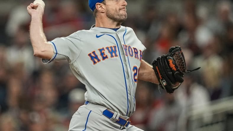Oct 1, 2022; Cumberland, Georgia, USA; New York Mets starting pitcher Max Scherzer (21) pitches against the Atlanta Braves during the first inning at Truist Park. Mandatory Credit: Dale Zanine-USA TODAY Sports