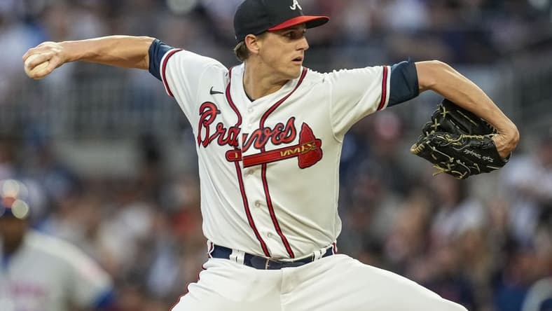 Oct 1, 2022; Cumberland, Georgia, USA; Atlanta Braves starting pitcher Kyle Wright (30) pitches against the New York Mets during the first inning at Truist Park. Mandatory Credit: Dale Zanine-USA TODAY Sports