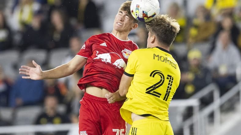 Oct 1, 2022; Columbus, Ohio, USA; New York Red Bulls midfielder Daniel Edelman (75) and Columbus Crew midfielder Aidan Morris (21) battle for the ball in the first half at Lower.com Field. Mandatory Credit: Greg Bartram-USA TODAY Sports