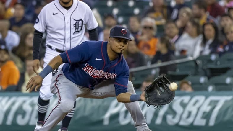 Oct 1, 2022; Detroit, Michigan, USA; Minnesota Twins first baseman Luis Arraez (2) catches the ball for an out in the fifth inning against the Detroit Tigers at Comerica Park. Mandatory Credit: David Reginek-USA TODAY Sports