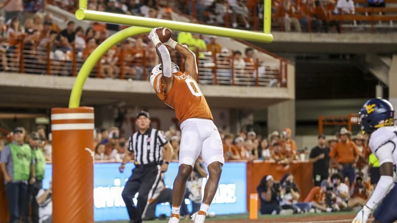 Oct 1, 2022; Austin, Texas, USA; Texas Longhorns tight end Ja'Tavion Sanders (0) catches a pass for a touchdown against the West Virginia Mountaineers during the second quarter at Darrell K Royal-Texas Memorial Stadium. Mandatory Credit: Ben Queen-USA TODAY Sports