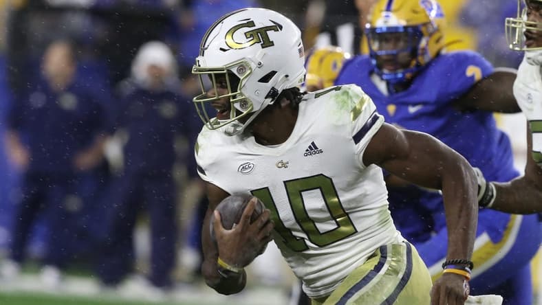Oct 1, 2022; Pittsburgh, Pennsylvania, USA;  Georgia Tech Yellow Jackets quarterback Jeff Sims (10) runs the ball against the Pittsburgh Panthers during the first quarter at Acrisure Stadium. Mandatory Credit: Charles LeClaire-USA TODAY Sports