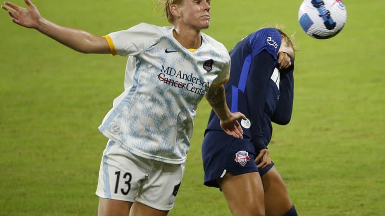 Oct 1, 2022; Washington, District of Columbia, USA; Houston Dash Sophie Schmidt (13) and Washington Spirit forward Trinity Rodman (2) battle for the ball in the second half at Audi Field. Mandatory Credit: Amber Searls-USA TODAY Sports