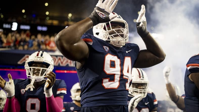 Oct 1, 2022; Tucson, Arizona, USA; Arizona Wildcats defensive lineman Dion Wilson Jr. (94) and the rest of his teammates walk out of the tunnel before facing the Colorado Buffaloes at Arizona Stadium. Mandatory Credit: Ivan Pierre Aguirre-USA TODAY Sports