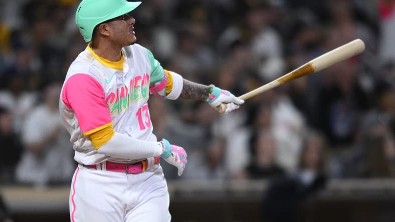 Oct 1, 2022; San Diego, California, USA; San Diego Padres third baseman Manny Machado (13) watches his home run against the Chicago White Sox during the seventh inning at Petco Park. Mandatory Credit: Orlando Ramirez-USA TODAY Sports