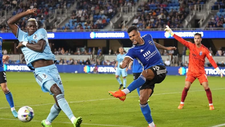 Oct 1, 2022; San Jose, California, USA; San Jose Earthquakes defender Rodrigues (26) clears the ball against Minnesota United forward Mender Garcia (28) during the first half at PayPal Park. Mandatory Credit: Darren Yamashita-USA TODAY Sports