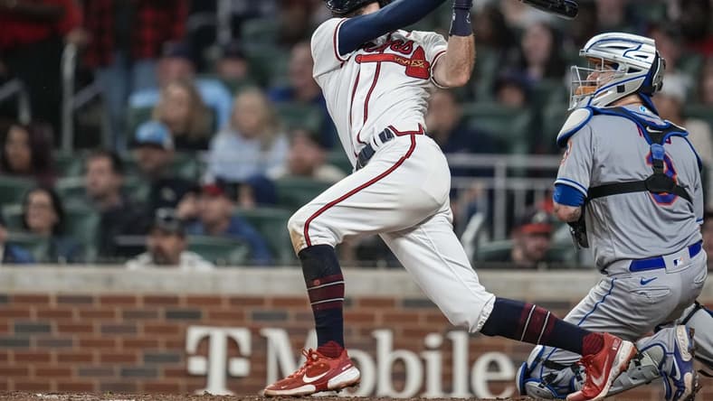 Oct 1, 2022; Cumberland, Georgia, USA; Atlanta Braves shortstop Dansby Swanson (7) hits a home run against the New York Mets during the fifth inning at Truist Park. Mandatory Credit: Dale Zanine-USA TODAY Sports