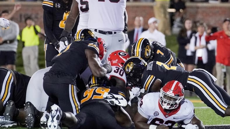 Oct 1, 2022; Columbia, Missouri, USA; Georgia Bulldogs running back Daijun Edwards (30) sores against the Missouri Tigers as offensive lineman Xavier Truss (73) celebrates during the first half at Faurot Field at Memorial Stadium. Mandatory Credit: Denny Medley-USA TODAY Sports