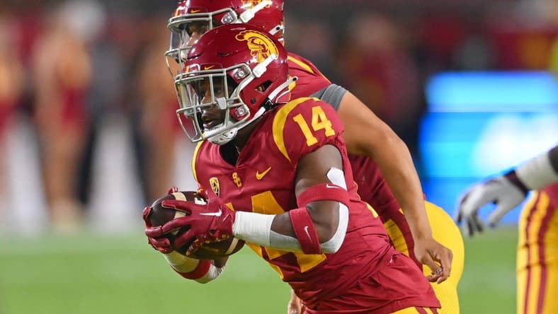 Oct 1, 2022; Los Angeles, California, USA;  USC Trojans running back Raleek Brown (14) takes a hand off from quarterback Caleb Williams (13) the first half against the Arizona State Sun Devils at United Airlines Field at the Los Angeles Memorial Coliseum. Mandatory Credit: Jayne Kamin-Oncea-USA TODAY Sports
