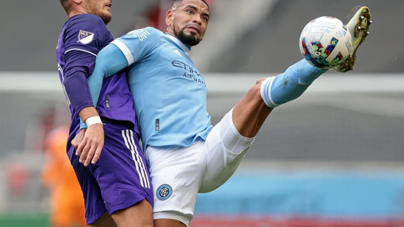 Oct 2, 2022; Harrison, New Jersey, USA; New York City FC defender Alexander Callens (6) battles for the ball against Orlando City SC forward Ercan Kara (9) during the first half at Red Bull Arena. Mandatory Credit: Vincent Carchietta-USA TODAY Sports