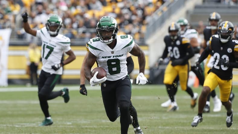 Oct 2, 2022; Pittsburgh, Pennsylvania, USA; New York Jets wide receiver Elijah Moore (8) runs after a catch against the Pittsburgh Steelers during the first quarter at Acrisure Stadium. Mandatory Credit: Charles LeClaire-USA TODAY Sports