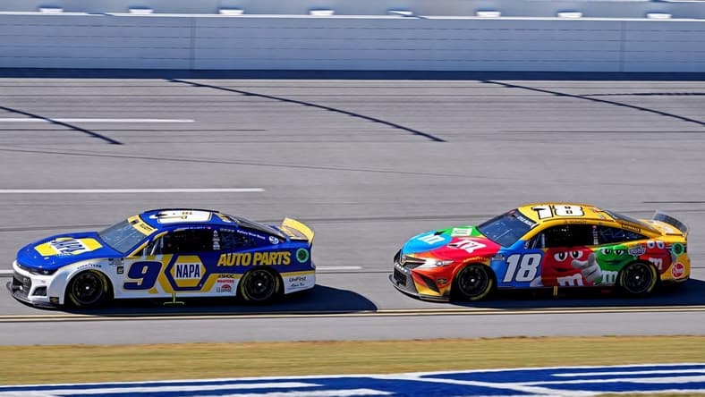 Oct 2, 2022; Talladega, Alabama, USA; NASCAR Cup Series driver Chase Elliott (9) and NASCAR Cup Series driver Kyle Busch (18) during the Yellawood 500 at Talladega Superspeedway. Mandatory Credit: Jasen Vinlove-USA TODAY Sports