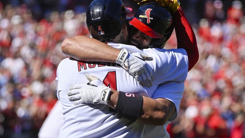 Oct 2, 2022; St. Louis, Missouri, USA; St. Louis Cardinals first baseman Albert Pujols (5) celebrates with catcher Yadier Molina (4) after hitting a solo home run for his 702nd career home run during the third inning against the Pittsburgh Pirates at Busch Stadium. Mandatory Credit: Jeff Curry-USA TODAY Sports