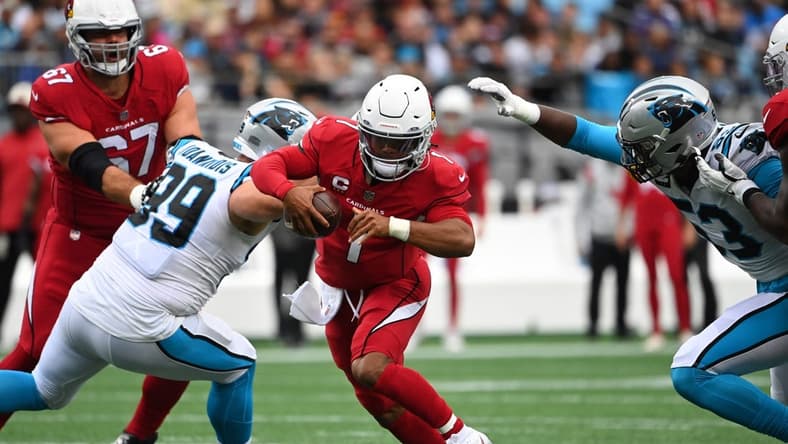 Oct 2, 2022; Charlotte, North Carolina, USA; Arizona Cardinals quarterback Kyler Murray (1) runs as Carolina Panthers defensive tackle Matt Ioannidis (99) and defensive end Brian Burns (53) defend in the first half at Bank of America Stadium. Mandatory Credit: Bob Donnan-USA TODAY Sports