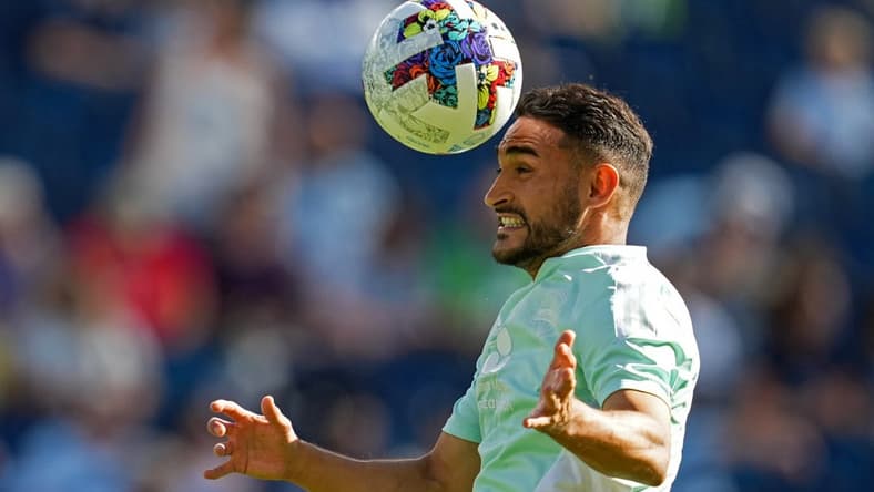 Oct 2, 2022; Kansas City, Kansas, USA; Seattle Sounders midfielder Cristian Roldan (7) warms up prior to a match against the Sporting Kansas City at Children's Mercy Park. Mandatory Credit: Jay Biggerstaff-USA TODAY Sports