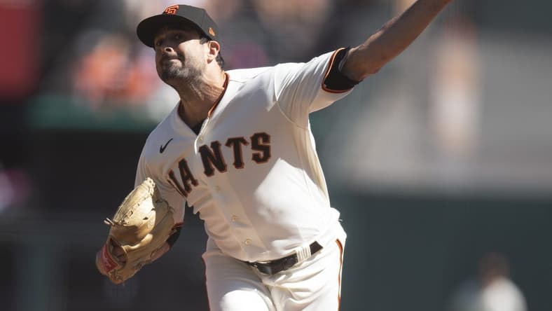 Oct 2, 2022; San Francisco, California, USA; San Francisco Giants starting pitcher Scott Alexander (54) delivers a pitch against the Arizona Diamondbacks during the first inning at Oracle Park. Mandatory Credit: D. Ross Cameron-USA TODAY Sports