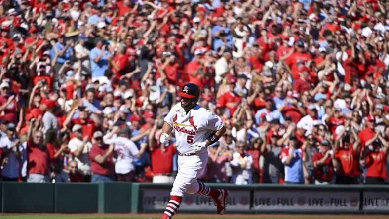 St. Louis Cardinals first baseman Albert Pujols (5) runs the bases after hitting a solo home run for his 702nd career home run during the third inning against the Pittsburgh Pirates at Busch Stadium. Mandatory Credit: Jeff Curry-USA TODAY Sports