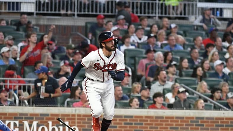 Oct 2, 2022; Cumberland, Georgia, USA; Atlanta Braves starting shortstop Dansby Swanson (7) hits a home run against the New York Mets in the first inning at Truist Park. Mandatory Credit: Larry Robinson-USA TODAY Sports