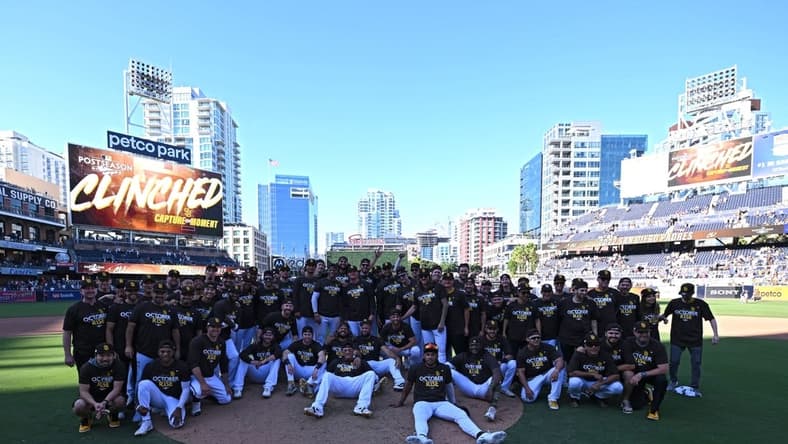 Oct 2, 2022; San Diego, California, USA; San Diego Padres players, coaches and staff pose for a photograph following the game against the Chicago White Sox after clinching a playoff berth at Petco Park. Mandatory Credit: Orlando Ramirez-USA TODAY Sports