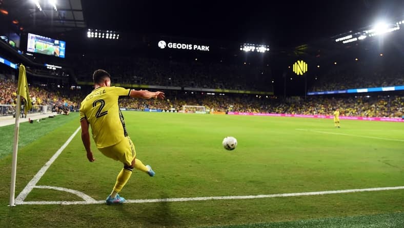 Oct 2, 2022; Nashville, Tennessee, USA; Nashville SC defender Daniel Lovitz (2) kicks a corner kick during the first half against the Houston Dynamo at Geodis Park. Mandatory Credit: Christopher Hanewinckel-USA TODAY Sports