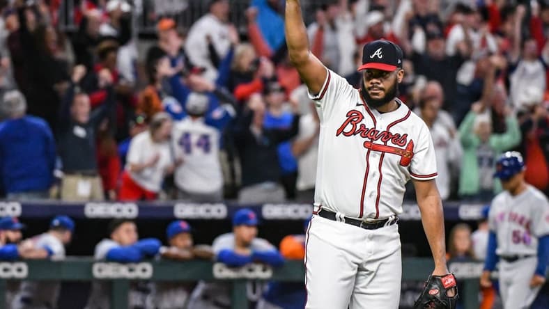 Oct 2, 2022; Cumberland, Georgia, USA; Atlanta Braves closing pitcher Kenley Jansen (74) reacts after striking out the final batter against the New York Mets in the ninth inning at Truist Park. Mandatory Credit: Larry Robinson-USA TODAY Sports