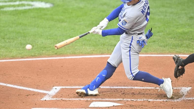 Oct 3, 2022; Cleveland, Ohio, USA; Kansas City Royals second baseman Michael Massey (19) singles in the second inning against the Cleveland Guardians at Progressive Field. Mandatory Credit: David Richard-USA TODAY Sports
