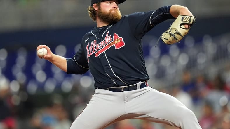 Oct 3, 2022; Miami, Florida, USA; Atlanta Braves starting pitcher Bryce Elder (55) delivers during the second inning against the Miami Marlins at loanDepot Park. Mandatory Credit: Jim Rassol-USA TODAY Sports