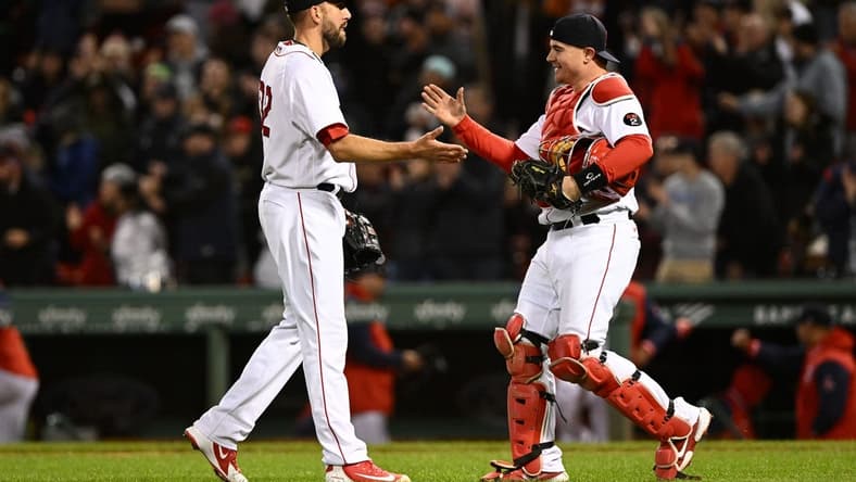 Oct 3, 2022; Boston, Massachusetts, USA; Boston Red Sox catcher Reese McGuire (3) high-fives relief pitcher Matt Barnes (32) after defeating the Tampa Bay Rays at Fenway Park. Mandatory Credit: Brian Fluharty-USA TODAY Sports