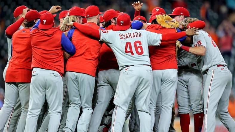 Oct 3, 2022; Houston, Texas, USA; Members of the Philadelphia Phillies celebrate after the final out against the Houston Astros during the ninth inning at Minute Maid Park. Philadelphia won 3-0 to clinch a National League Wild Card berth. Mandatory Credit: Erik Williams-USA TODAY Sports