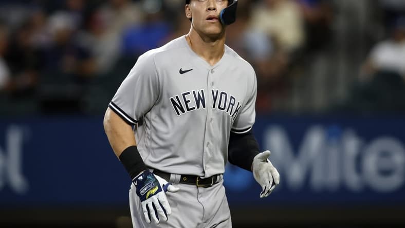 Oct 4, 2022; Arlington, Texas, USA; New York Yankees designated hitter Aaron Judge (99) watches a replay of his pop out in the fifth inning against the Texas Rangers at Globe Life Field. Mandatory Credit: Tim Heitman-USA TODAY Sports