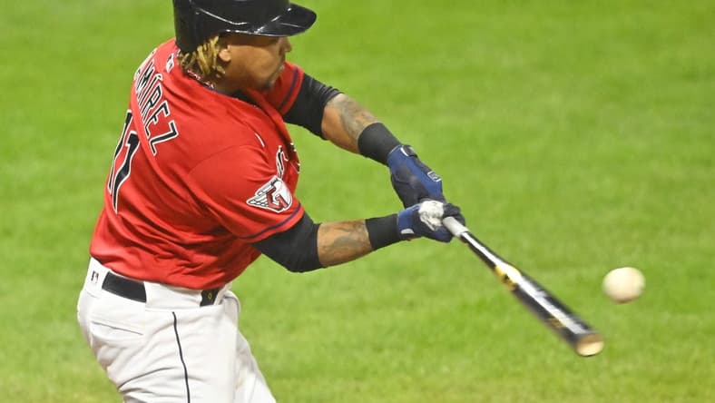 Oct 4, 2022; Cleveland, Ohio, USA; Cleveland Guardians designated hitter Jose Ramirez (11) hits a two-RBI double in the fifth inning against the Kansas City Royals at Progressive Field. Mandatory Credit: David Richard-USA TODAY Sports