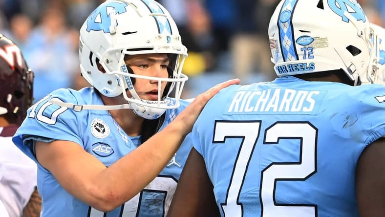 Oct 1, 2022; Chapel Hill, North Carolina, USA; North Carolina Tar Heels quarterback Drake Maye (10) with offensive lineman Asim Richards (72) in the third quarter at Kenan Memorial Stadium. Mandatory Credit: Bob Donnan-USA TODAY Sports