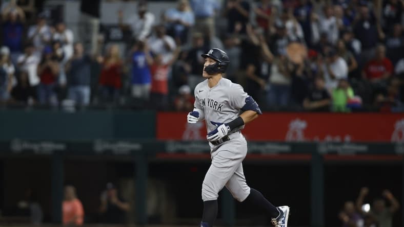 Oct 4, 2022; Arlington, Texas, USA; New York Yankees right fielder Aaron Judge (99) rounds the bases after hitting home run number sixty-two to break the American League home run record in the first inning against the Texas Rangers at Globe Life Field. Mandatory Credit: Tim Heitman-USA TODAY Sports