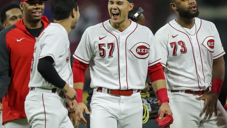 Oct 4, 2022; Cincinnati, Ohio, USA; Cincinnati Reds left fielder Stuart Fairchild (57) reacts after scoring a walk-off double hit by third baseman Spencer Steer (not pictured) in the ninth inning against the Chicago Cubs at Great American Ball Park. Mandatory Credit: Katie Stratman-USA TODAY Sports