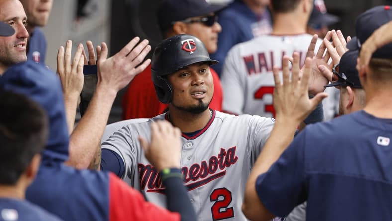 Oct 5, 2022; Chicago, Illinois, USA; Minnesota Twins first baseman Luis Arraez (2) celebrates with teammates after scoring against the Chicago White Sox during the second inning at Guaranteed Rate Field. Mandatory Credit: Kamil Krzaczynski-USA TODAY Sports