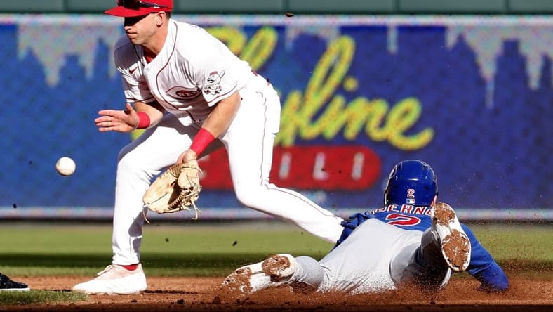 Oct 5, 2022; Cincinnati, Ohio, USA; Chicago Cubs shortstop Nico Hoerner (2) steals second against Cincinnati Reds second baseman Spencer Steer (12) during the second inning at Great American Ball Park. Mandatory Credit: David Kohl-USA TODAY Sports