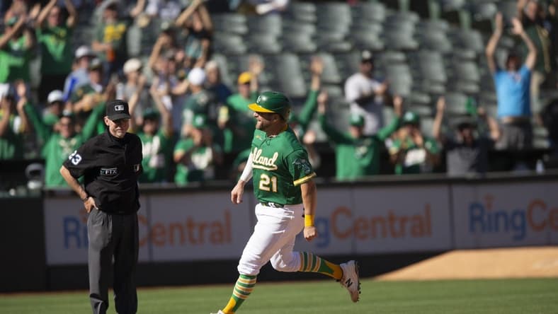 Oct 5, 2022; Oakland, California, USA; Oakland Athletics catcher Stephen Vogt (21) runs out his solo home run against the Los Angeles Angels during the seventh inning at RingCentral Coliseum. Umpire is Lance Barksdale. Mandatory Credit: D. Ross Cameron-USA TODAY Sports