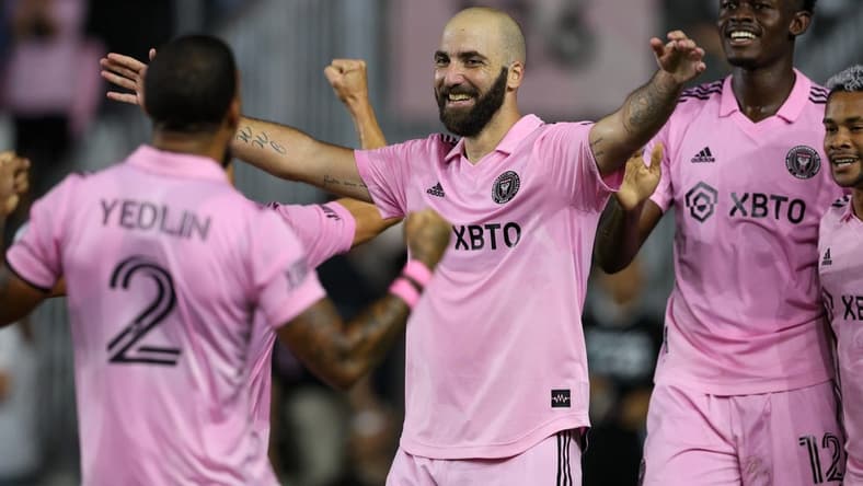 Oct 5, 2022; Fort Lauderdale, Florida, USA;  Inter Miami forward Gonzalo Higuain (10) is congratulated by defender DeAndre Yedlin (2) after scoring a goal against Orlando City in the first half  at DRV PNK Stadium. Mandatory Credit: Nathan Ray Seebeck-USA TODAY Sports