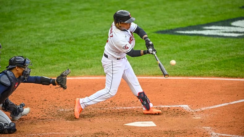Oct 7, 2022; Cleveland, Ohio, USA; Cleveland Guardians third baseman Jose Ramirez (11) hits a two run home run against the Tampa Bay Rays in the sixth inning during game one of the Wild Card series for the 2022 MLB Playoffs at Progressive Field. Mandatory Credit: David Richard-USA TODAY Sports