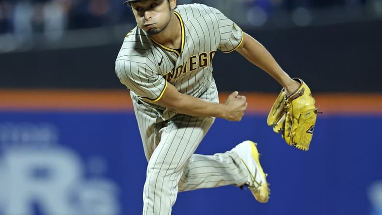 Oct 7, 2022; New York City, New York, USA; San Diego Padres starting pitcher Yu Darvish (11) throws a pitch in the first inning during game one of the Wild Card series against the New York Mets for the 2022 MLB Playoffs at Citi Field. Mandatory Credit: Brad Penner-USA TODAY Sports
