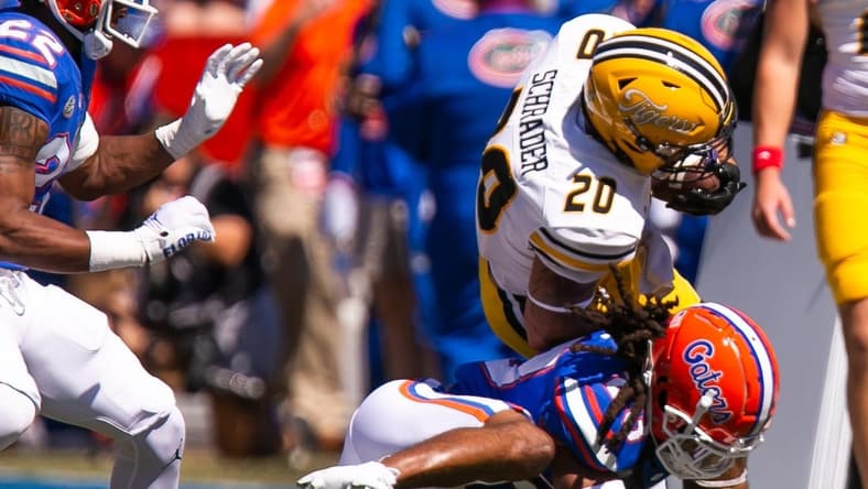 Florida Gators safety Corey Collier Jr. (20) tackles Missouri Tigers running back Cody Schrader (20) in the first half at Steve Spurrier Field at Ben Hill Griffin Stadium in Gainesville, FL on Saturday, October 8, 2022. [Doug Engle/Gainesville Sun]

Ncaa Football Florida Gators Vs Missouri Tigers