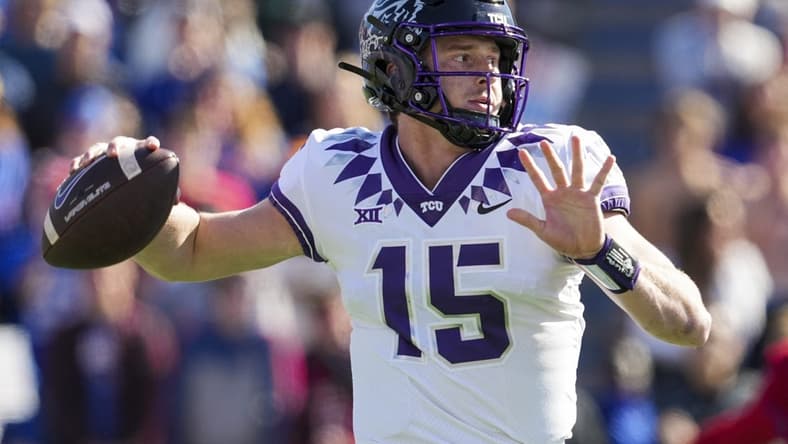 Oct 8, 2022; Lawrence, Kansas, USA; TCU Horned Frogs quarterback Max Duggan (15) throws a pass during the first half against the Kansas Jayhawks at David Booth Kansas Memorial Stadium. Mandatory Credit: Jay Biggerstaff-USA TODAY Sports