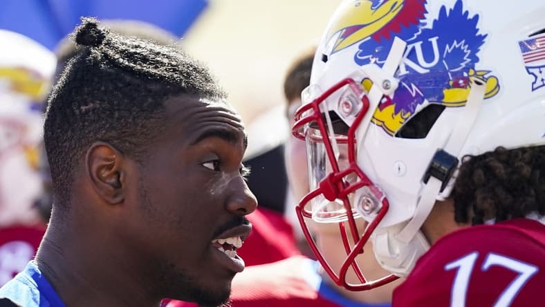 Oct 8, 2022; Lawrence, Kansas, USA; Kansas Jayhawks quarterback Jalon Daniels (6) talks with quarterback Jason Bean (17) after leaving the game with an injury during the second half against the TCU Horned Frogs at David Booth Kansas Memorial Stadium. Mandatory Credit: Jay Biggerstaff-USA TODAY Sports
