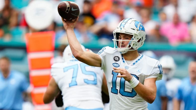 Oct 8, 2022; Miami Gardens, Florida, USA; North Carolina Tar Heels quarterback Drake Maye (10) throws a pass against the Miami Hurricanes during the first quarter at Hard Rock Stadium. Mandatory Credit: Rich Storry-USA TODAY Sports