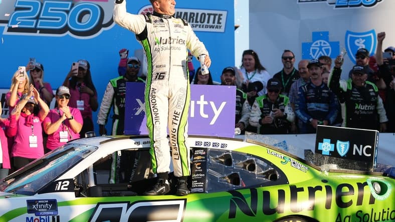 Oct 8, 2022; Concord, North Carolina, USA; NASCAR Xfinity Series driver AJ Allmendinger (16) celebrates after winning the Drive for the Cure 250 at Charlotte Motor Speedway Road Course. Mandatory Credit: Jasen Vinlove-USA TODAY Sports