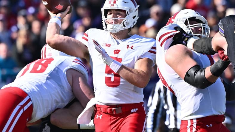 Oct 8, 2022; Evanston, Illinois, USA; Wisconsin Badgers quarterback Graham Mertz (5) throws a pass in the first quarter against the Northwestern Wildcats at Ryan Field. Mandatory Credit: Jamie Sabau-USA TODAY Sports